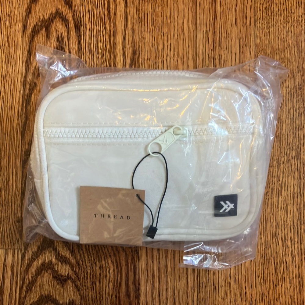 Brand new Thread Wallets fanny pack in the color off white.